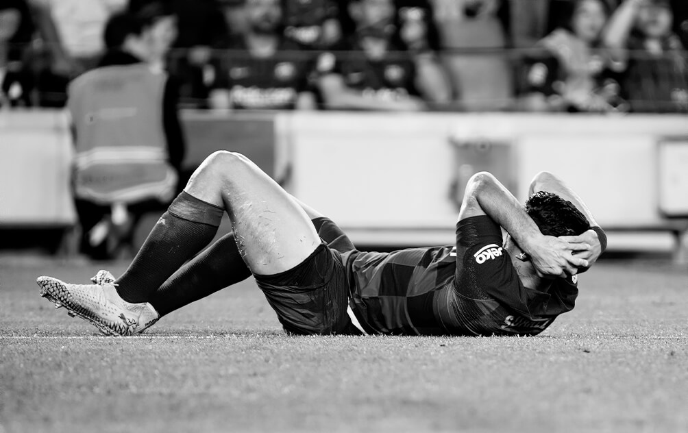 Football player with hand or wrist injury requiring specialist treatment